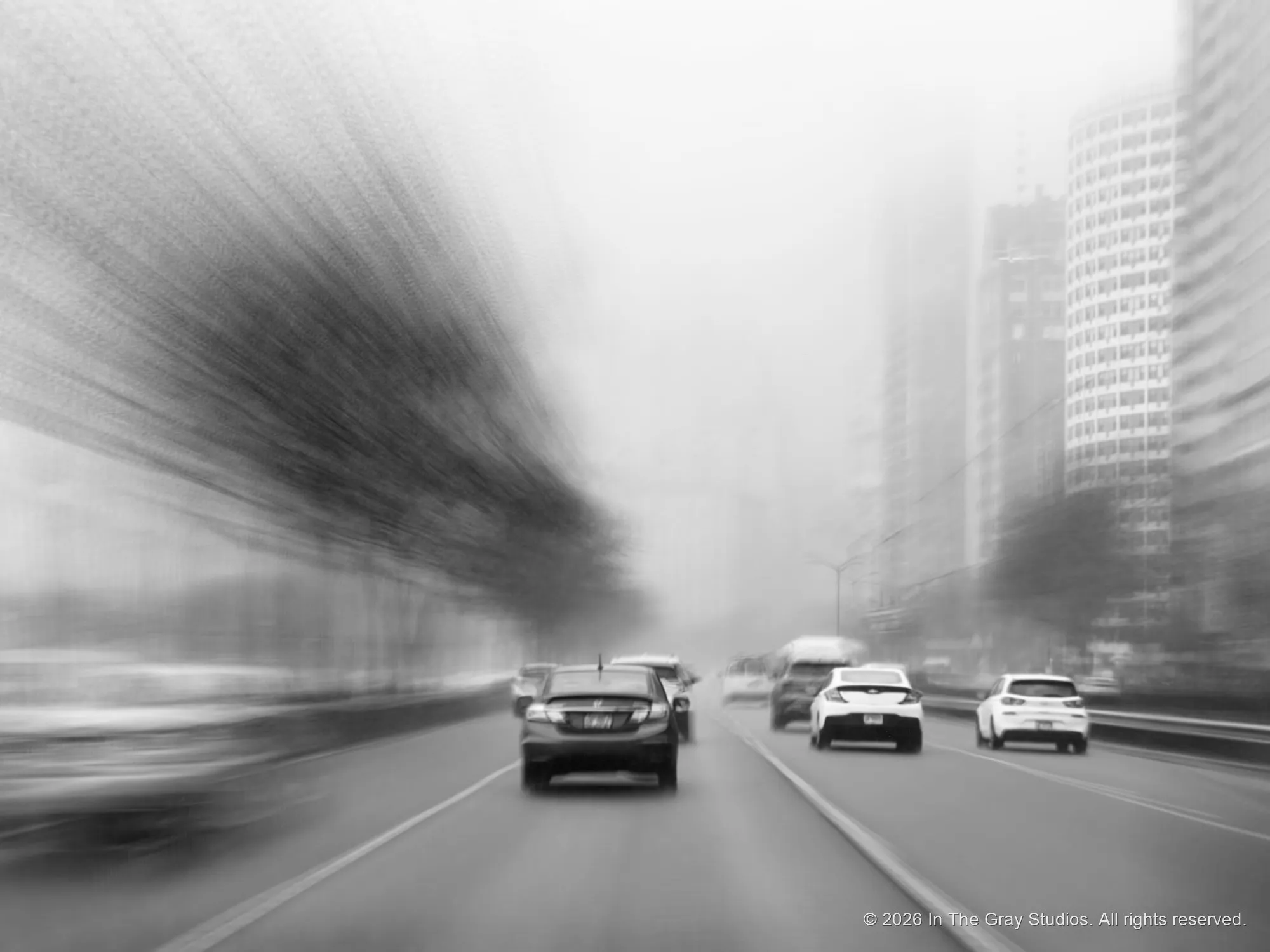 Traffic streaked into motion blur in black and white